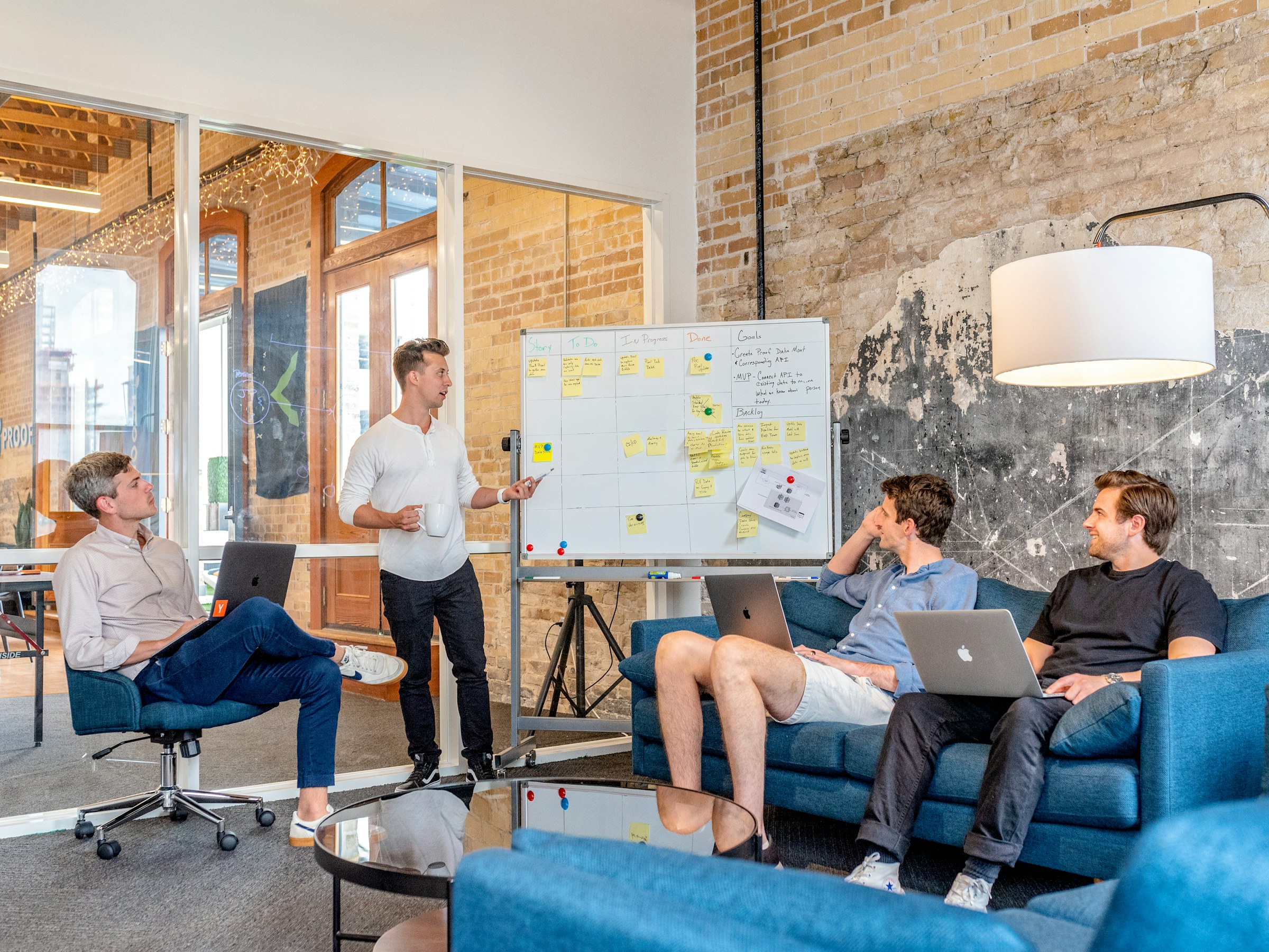 Team working through a go-to-market strategy at a whiteboard