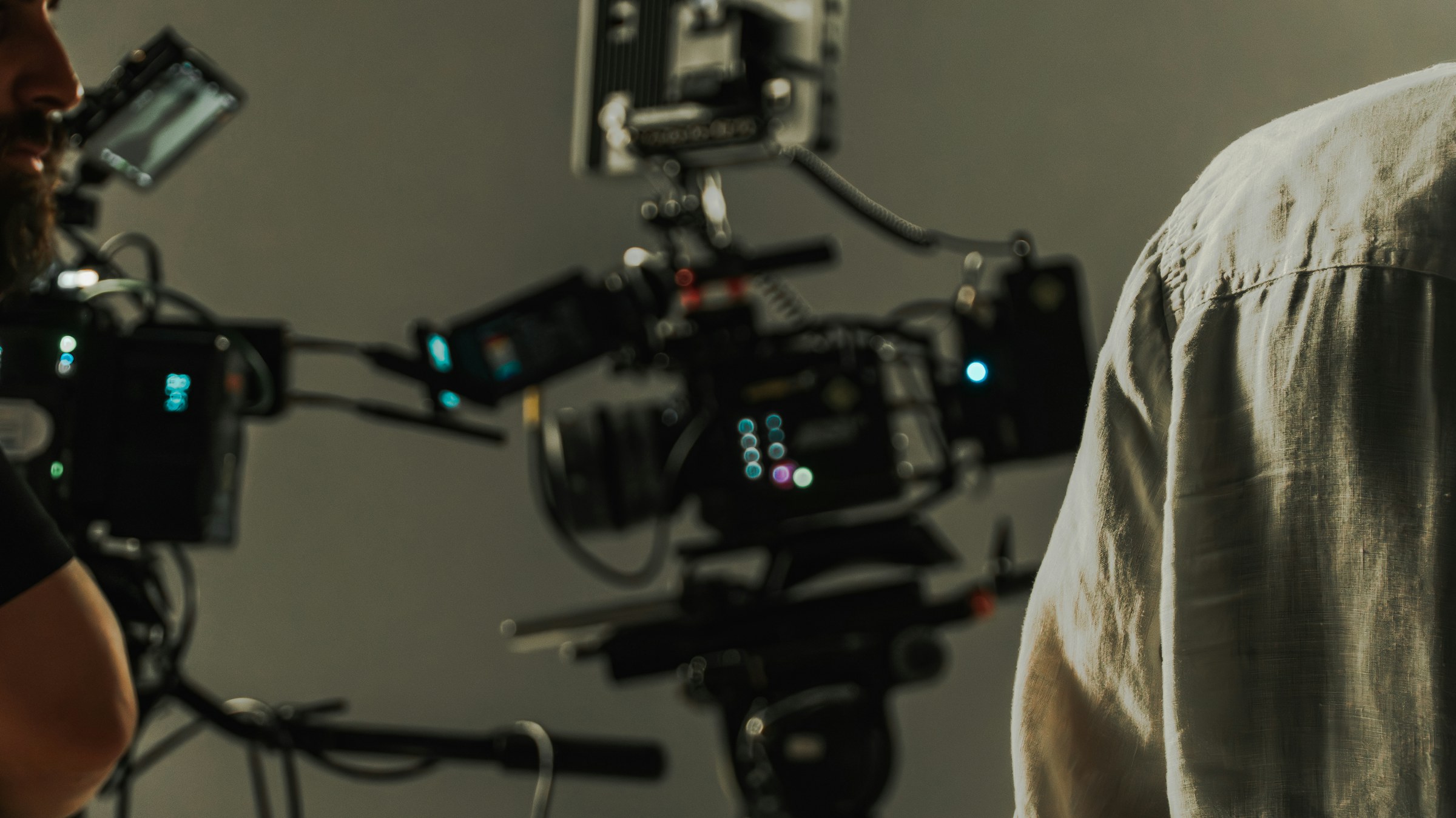 Cinema camera rig and crew preparing a shot on a professional film production set